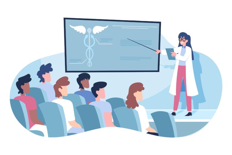 Une professionnelle de santé présente un schéma médical devant un groupe de personnes assises dans une salle de conférence.